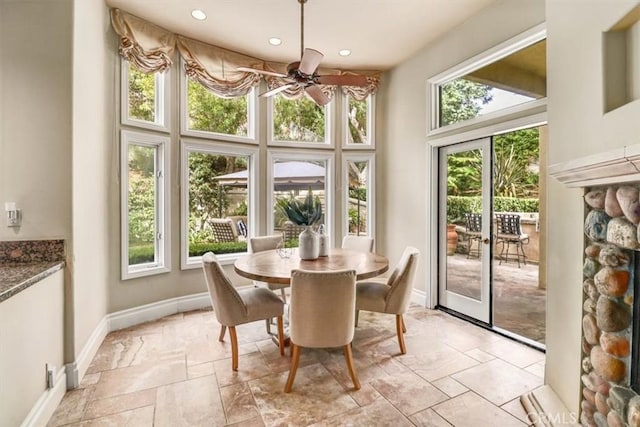 interior space with ceiling fan and a healthy amount of sunlight