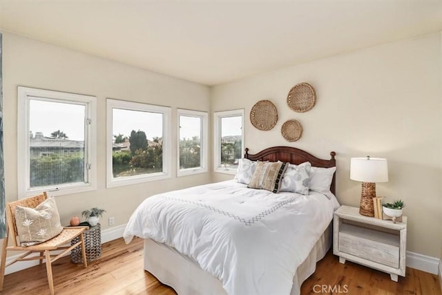 bedroom with hardwood / wood-style floors