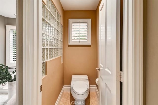 bathroom with tile patterned flooring and toilet