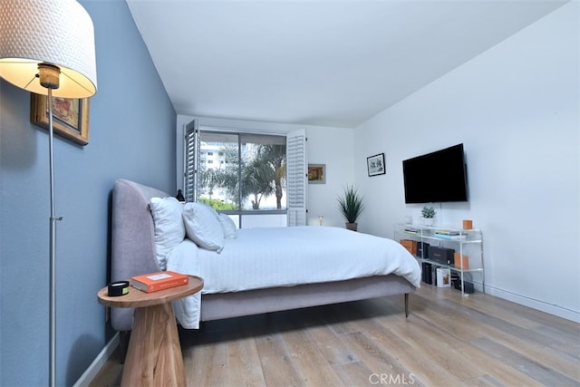 bedroom with light hardwood / wood-style flooring