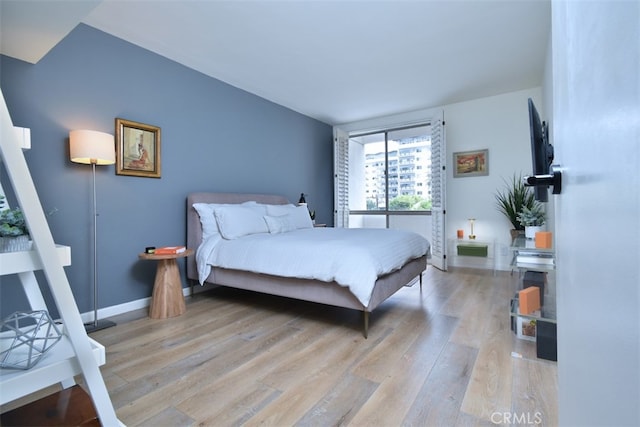 bedroom with light hardwood / wood-style flooring