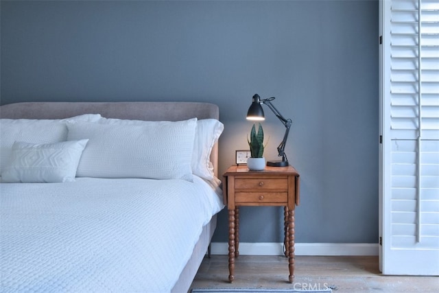 bedroom with wood-type flooring