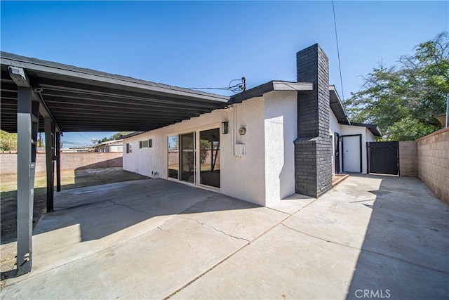 rear view of house featuring a patio