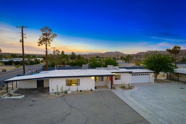 view of front of property featuring a mountain view and a garage