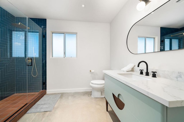 bathroom with vanity, toilet, and a shower with shower door