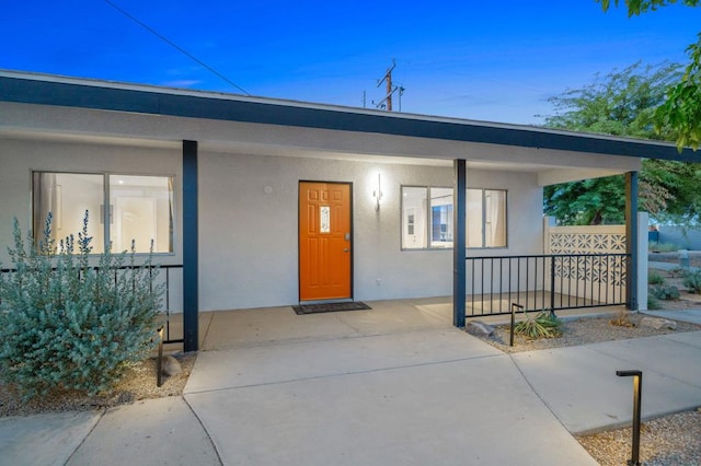 doorway to property with covered porch