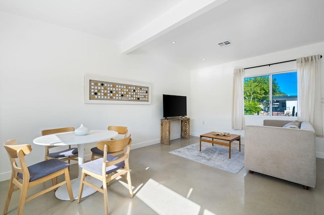 dining area featuring lofted ceiling with beams