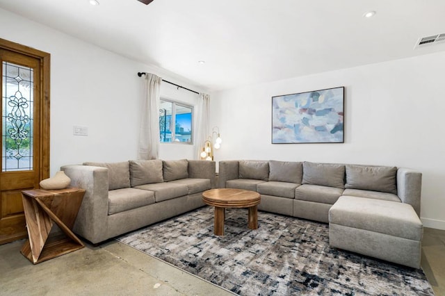 living room featuring concrete floors