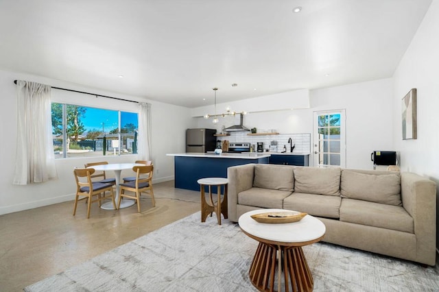 living room featuring sink and a wealth of natural light