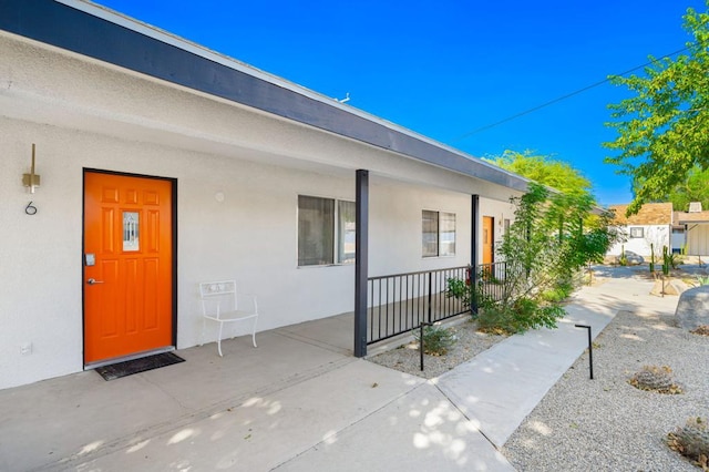 doorway to property featuring covered porch