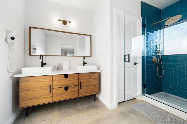 bathroom featuring vanity and a shower with shower door