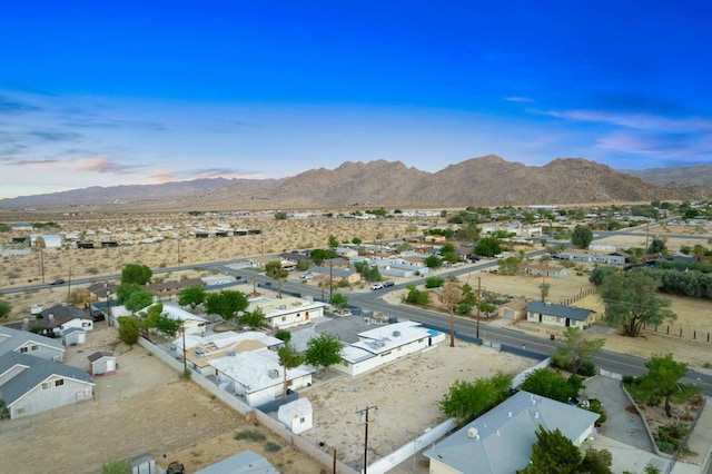 birds eye view of property featuring a mountain view