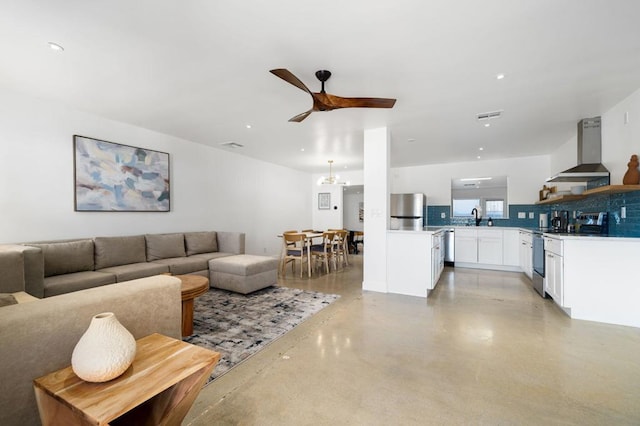 living room with ceiling fan and sink