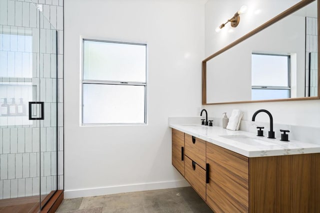 bathroom with vanity and a shower with door