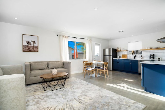 living room featuring sink