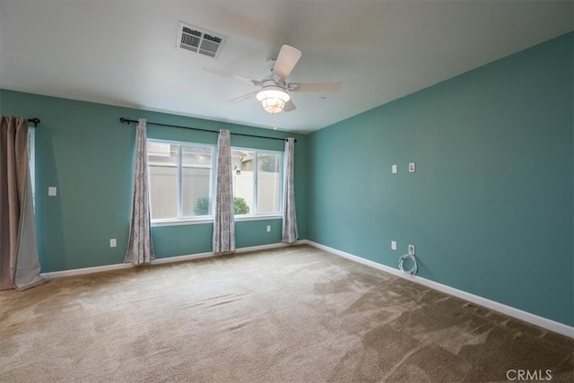 carpeted empty room with ceiling fan