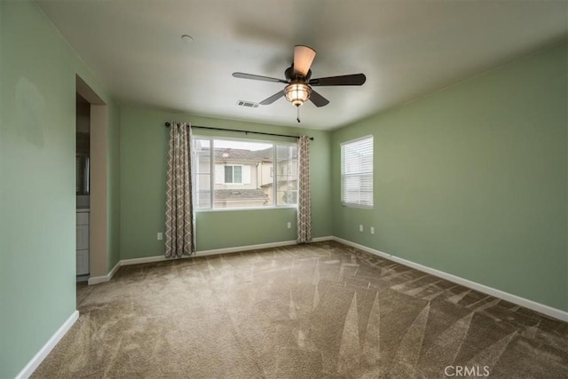 unfurnished room featuring carpet flooring and ceiling fan