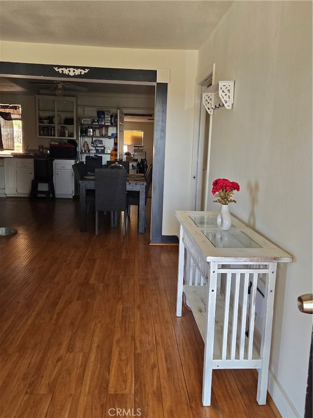 dining space with dark wood-type flooring