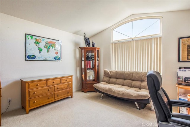 office area with light carpet and vaulted ceiling