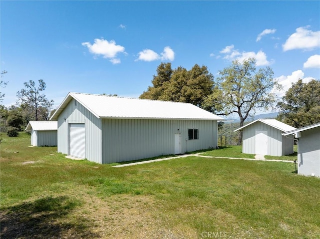 31188 Tera Tera Ranch Rd, North Fork, CA 93643 - view of pole building with a lawn