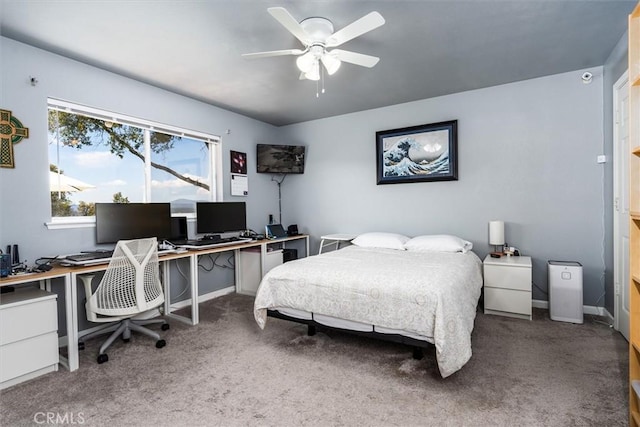 bedroom with carpet flooring, baseboards, and ceiling fan