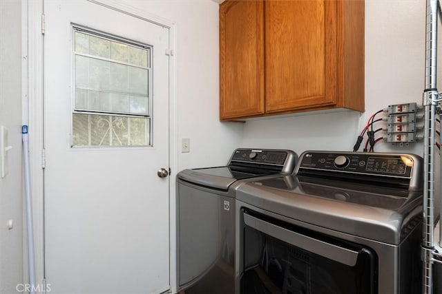 laundry area with cabinet space and washing machine and dryer