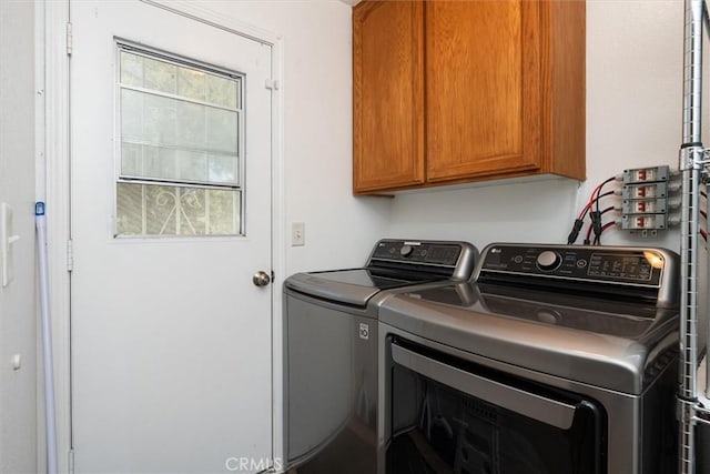 31188 Tera Tera Ranch Rd, North Fork, CA 93643 - washroom featuring cabinet space and washing machine and clothes dryer