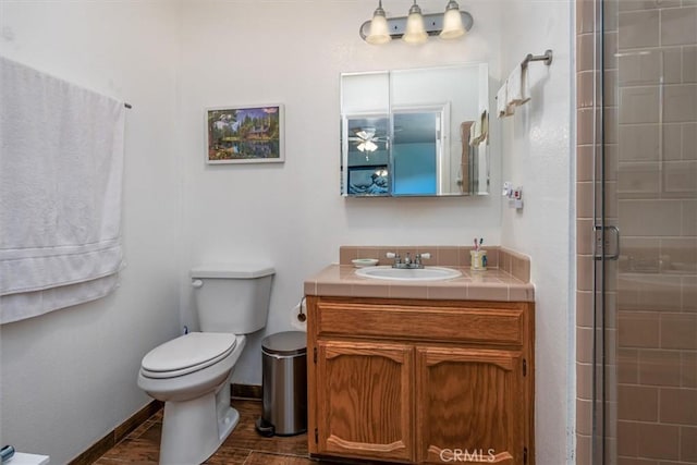 31188 Tera Tera Ranch Rd, North Fork, CA 93643 - bathroom featuring vanity, tiled shower, and wood finished floors