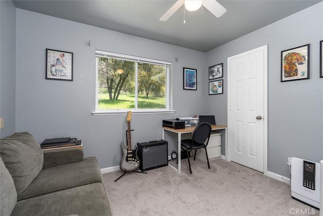 office space with a ceiling fan, carpet, and baseboards