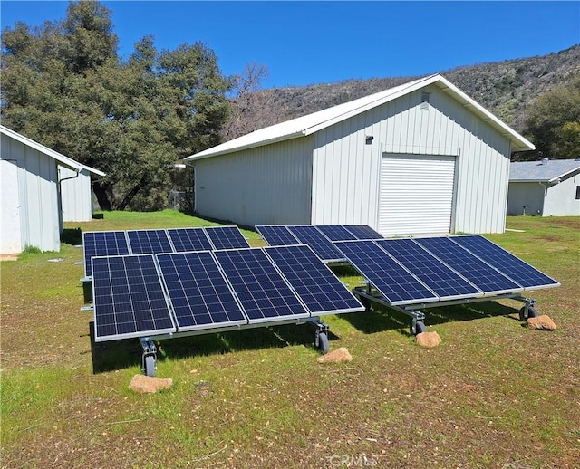 view of outbuilding with solar panels