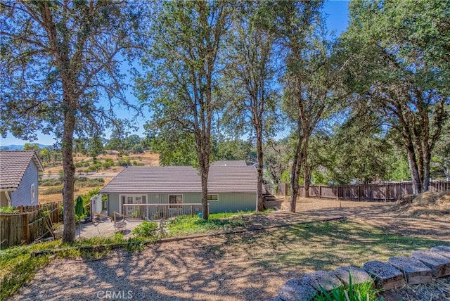 exterior space featuring a fenced backyard and a patio