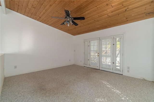 empty room featuring wooden ceiling, carpet floors, a ceiling fan, vaulted ceiling, and french doors