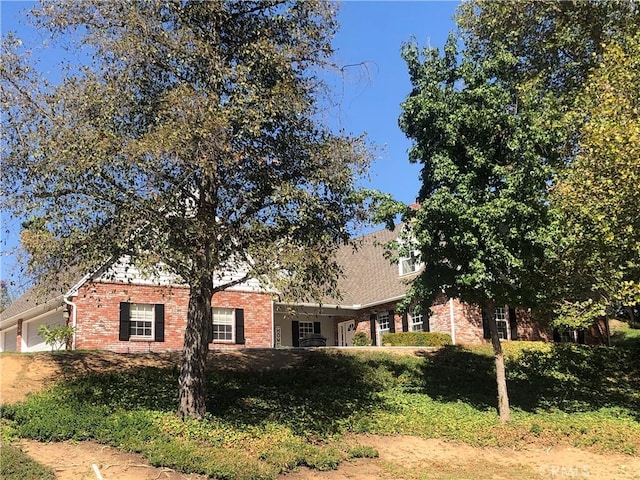 view of property exterior featuring a garage