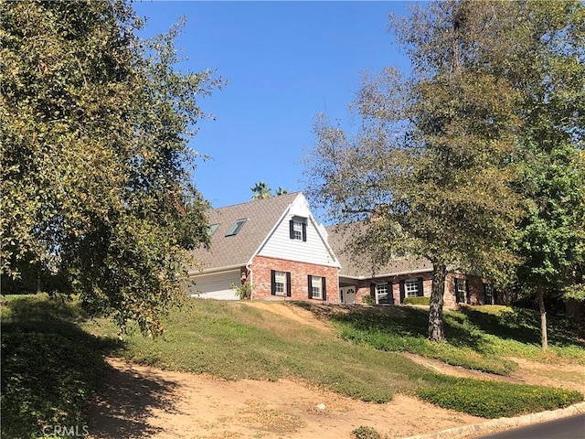 view of side of home featuring a garage