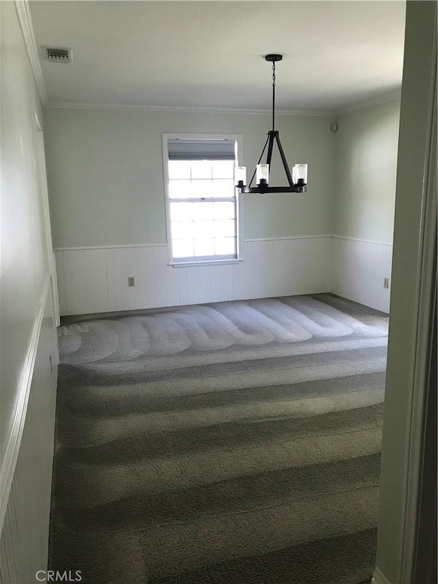 stairway with carpet flooring, a notable chandelier, and crown molding