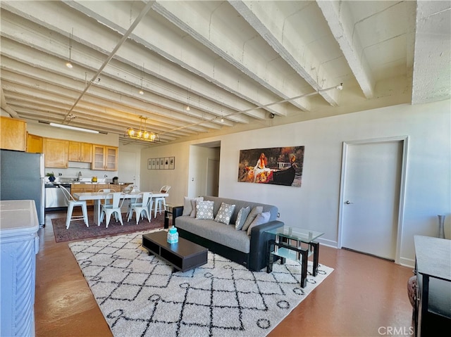 living room with a notable chandelier