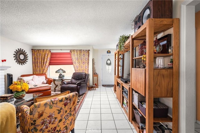 living room featuring light tile patterned floors and a textured ceiling