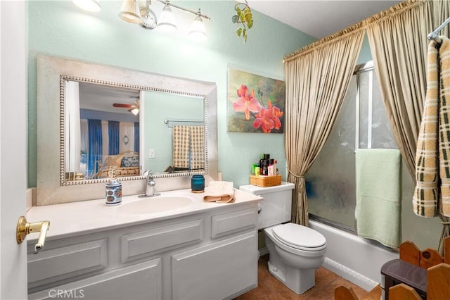 full bathroom featuring vanity, ceiling fan, enclosed tub / shower combo, tile patterned flooring, and toilet