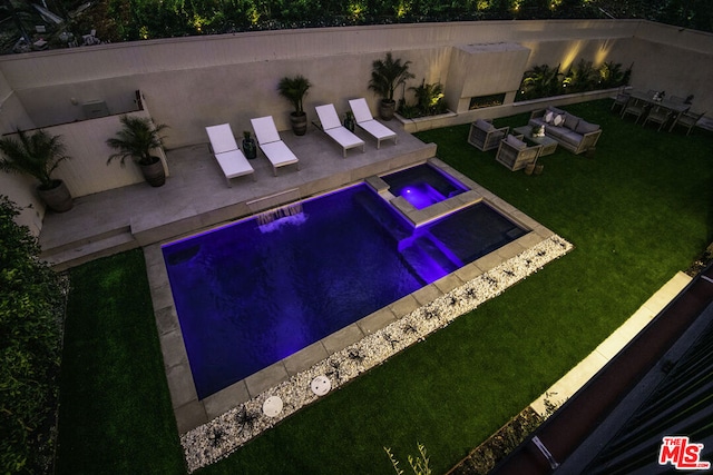 view of swimming pool featuring an in ground hot tub, a yard, and a patio