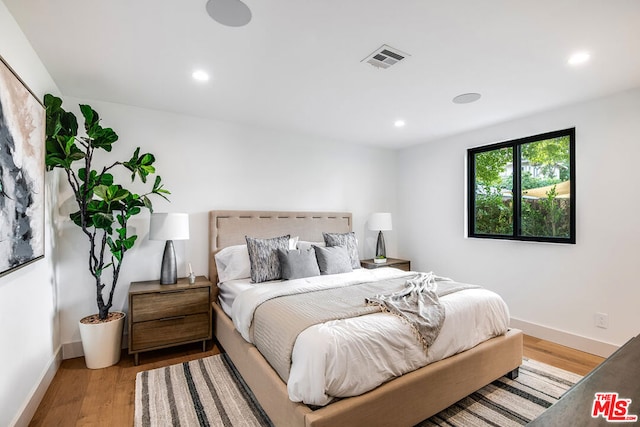 bedroom with light hardwood / wood-style floors