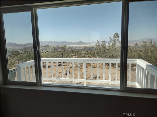 balcony featuring a mountain view