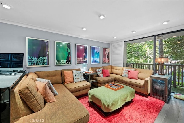 living room featuring wood-type flooring and ornamental molding