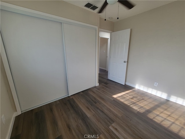 bedroom with cooling unit, ceiling fan, hardwood / wood-style floors, and a textured ceiling