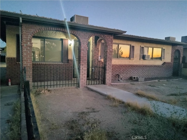 view of front of property with cooling unit