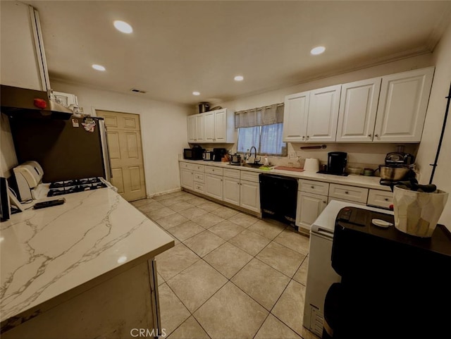 kitchen featuring black dishwasher, sink, crown molding, white cabinets, and stainless steel refrigerator