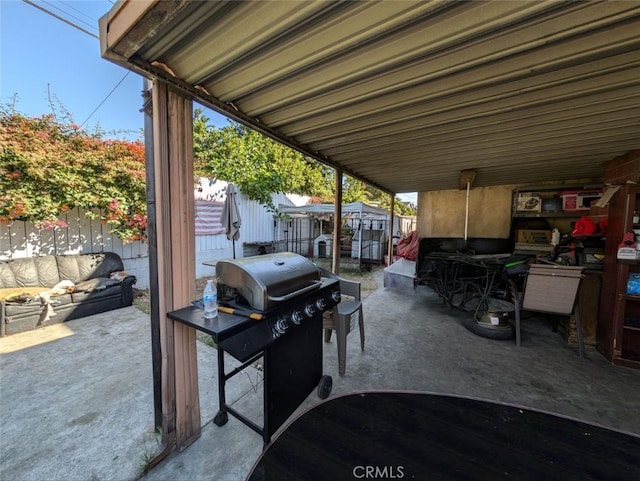 view of patio featuring a grill