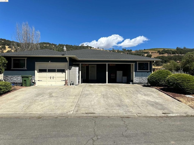 ranch-style home featuring a garage