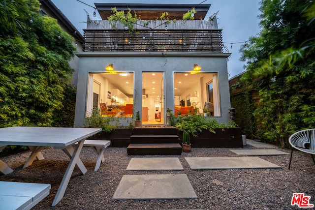 rear view of house featuring a patio