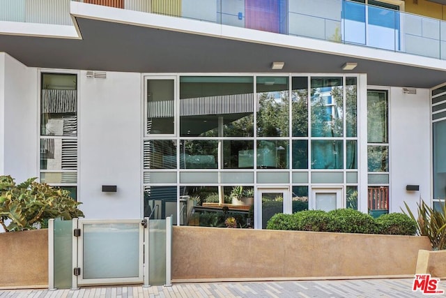 property entrance with a balcony