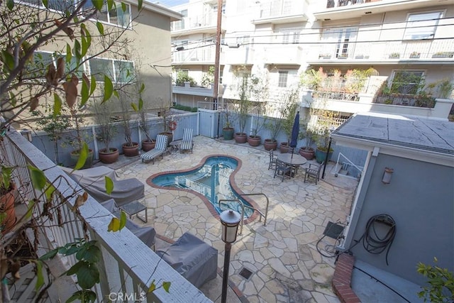 view of swimming pool featuring a patio